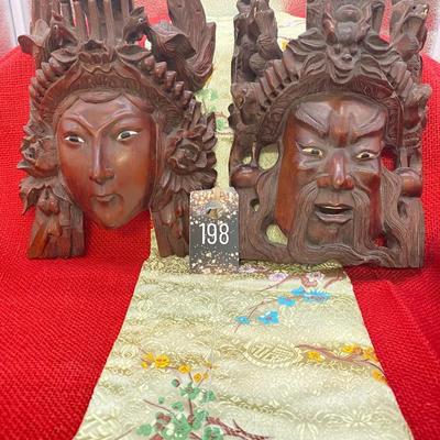 Sale Photo Thumbnail #180: The Male figure is 6 inches wide x 8 inches tall.
The are dragons on each side of the mask on the top, there is sone wear on the dragons teeth.

The female figure is 6 inches wide x 8 inches tall.  
There are birds on each side of the mask on the top port