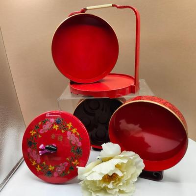 Sale Photo Thumbnail #197: Stackable, tiered lunch food carrier, made with red lacquer with black floral pattern.
Excellent condition