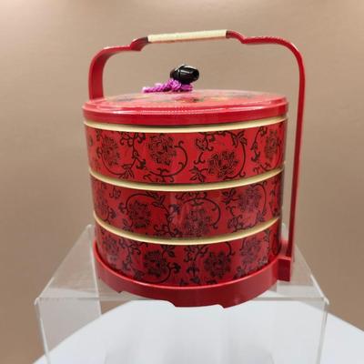 Sale Photo Thumbnail #196: Stackable, tiered lunch food carrier, made with red lacquer with black floral pattern.
Excellent condition