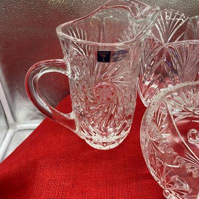 Sale Photo Thumbnail #201: Vintage crystal footed bowl, 7 inch diameter   
Handcut lead crystal pitcher, buzzstar pattern, made in Yugoslavia
Crystal ice bucket, Portico, 
All in good condition
Retail $140
