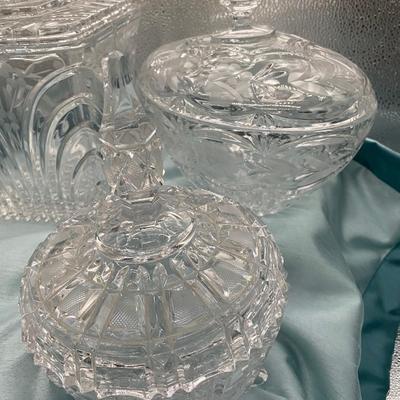 Sale Photo Thumbnail #221: 1 round candy dish  9 inches tall x 6.5  inches wide, with lid
1 oval candy dish with lid
1 square biscuit jar  6.5 inch diametr x 8 inches tall 
Very good condition
Retail $100