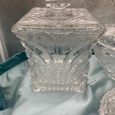 Sale Photo Thumbnail #220: 1 round candy dish  9 inches tall x 6.5  inches wide, with lid
1 oval candy dish with lid
1 square biscuit jar  6.5 inch diametr x 8 inches tall 
Very good condition
Retail $100