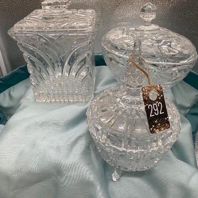 Sale Photo Thumbnail #219: 1 round candy dish  9 inches tall x 6.5  inches wide, with lid
1 oval candy dish with lid
1 square biscuit jar  6.5 inch diametr x 8 inches tall 
Very good condition
Retail $100