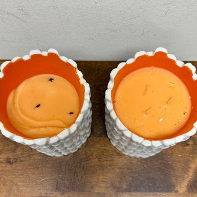 Sale Photo Thumbnail #493: Real orange color wax candles inside white ceramic bamboo-themed holders.  Approx. 6.5" tall x 4.5" across. Scented candles with a Guava fragrance.
