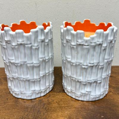 Sale Photo Thumbnail #496: Real orange color wax candles inside white ceramic bamboo-themed holders.  Approx. 6.5" tall x 4.5" across. Scented candles with a Guava fragrance.