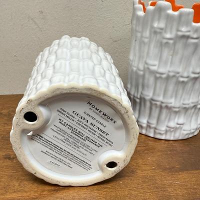 Sale Photo Thumbnail #492: Real orange color wax candles inside white ceramic bamboo-themed holders.  Approx. 6.5" tall x 4.5" across. Scented candles with a Guava fragrance.