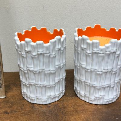 Sale Photo Thumbnail #495: Real orange color wax candles inside white ceramic bamboo-themed holders.  Approx. 6.5" tall x 4.5" across. Scented candles with a Guava fragrance.