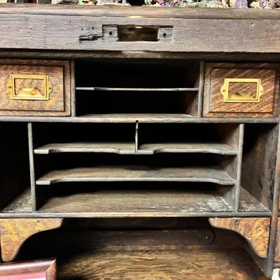 Antique Derby Roll Top Desk in Excellent condition—solid oak--32 1/2 inches deep x 53 1/2 inches wide x 51 inches high at its highest...