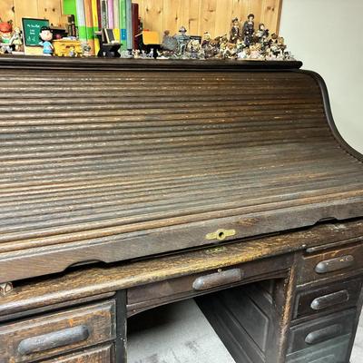 Antique Derby Roll Top Desk in Excellent condition—solid oak--32 1/2 inches deep x 53 1/2 inches wide x 51 inches high at its highest...