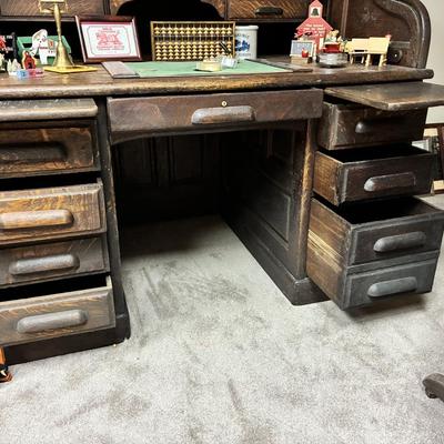 Antique Derby Roll Top Desk in Excellent condition—solid oak--32 1/2 inches deep x 53 1/2 inches wide x 51 inches high at its highest...