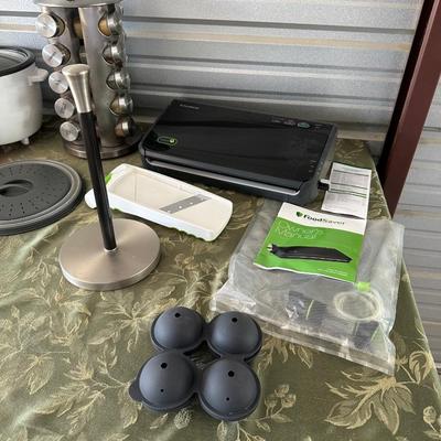 FOOD SAVER (LIKE SEAL A MEAL), ROTATING SPICE RACK AND MORE