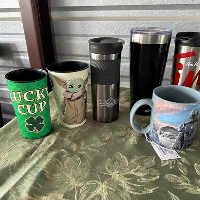 AN ARRAY OF TRAVEL CUPS, DRINKING GLASSES AND MORE