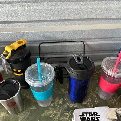 AN ARRAY OF TRAVEL CUPS, DRINKING GLASSES AND MORE