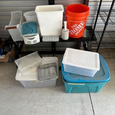 AN ASSORTMENT OF CONTAINERS, HANGERS AND A ROLL OF PLASTIC WRAP