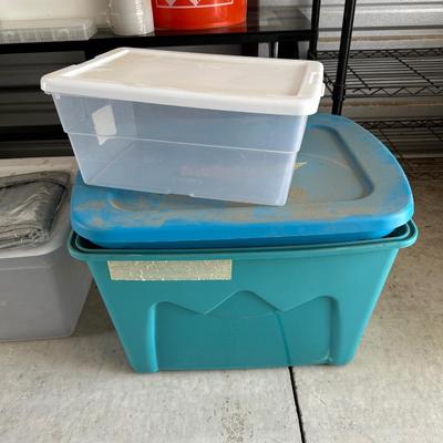 AN ASSORTMENT OF CONTAINERS, HANGERS AND A ROLL OF PLASTIC WRAP