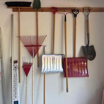 Assortment of rakes, shovels