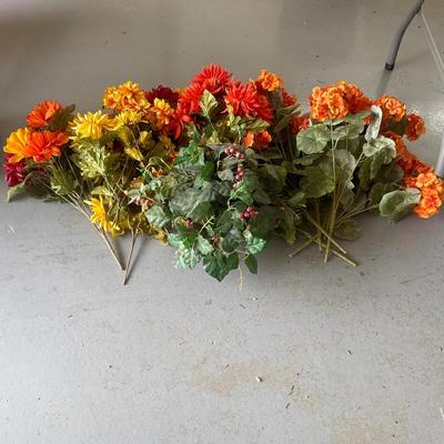 Assortment of faux plants and flowers