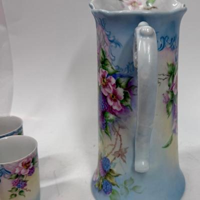 Sale Photo Thumbnail #7: Pale blue and white ceramic pitcher and cups.  Hand painted in 1968 by local artist Dorothy Tillotson of Tustin in 1968.  All in very good condition, no chips or cracks.