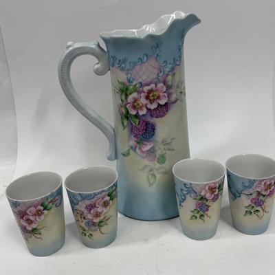 Sale Photo Thumbnail #1: Pale blue and white ceramic pitcher and cups.  Hand painted in 1968 by local artist Dorothy Tillotson of Tustin in 1968.  All in very good condition, no chips or cracks.