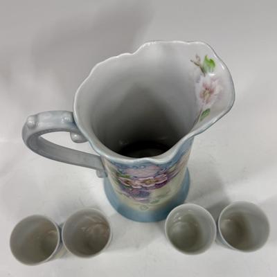 Sale Photo Thumbnail #2: Pale blue and white ceramic pitcher and cups.  Hand painted in 1968 by local artist Dorothy Tillotson of Tustin in 1968.  All in very good condition, no chips or cracks.