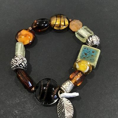 Glass art bead bracelet with charms