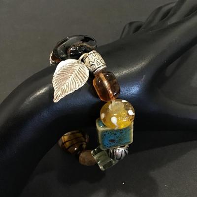 Glass art bead bracelet with charms