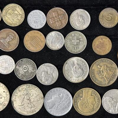 AN ASSORTMENT OF FOREIGN COINS