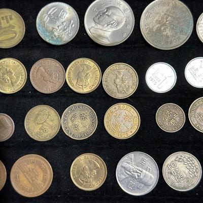 AN ASSORTMENT OF FOREIGN COINS