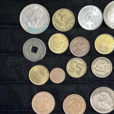 AN ASSORTMENT OF FOREIGN COINS