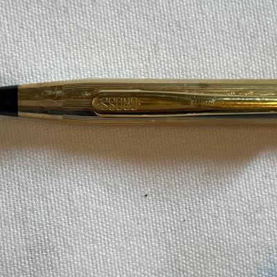 Gold tone charms and pins and Cross pen