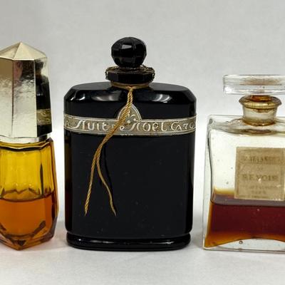 Sale Photo Thumbnail #144: Amber glass with gold top is AVON TIMELESS COLOGNE
Black glass bottle is CARON'S NUIT DE NOEL PERFUME
Clear glass is CHANNEL NO. 5PERFUME

They have about 1/2 of the perfume left inside.