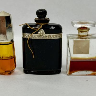 Sale Photo Thumbnail #146: Amber glass with gold top is AVON TIMELESS COLOGNE
Black glass bottle is CARON'S NUIT DE NOEL PERFUME
Clear glass is CHANNEL NO. 5PERFUME

They have about 1/2 of the perfume left inside.