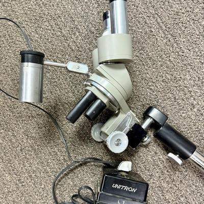 Sale Photo Thumbnail #198: Includes microscope, adjustable no-vibrate weighted stand, and variable brightness light. Tested, light works and microscope appears to be in working condition.