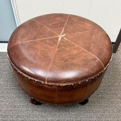 Sale Photo Thumbnail #173: Covered in brown leather, some loose stitching in the top center (see photos).
