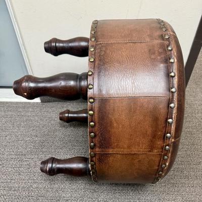Sale Photo Thumbnail #178: Covered in brown leather, some loose stitching in the top center (see photos).