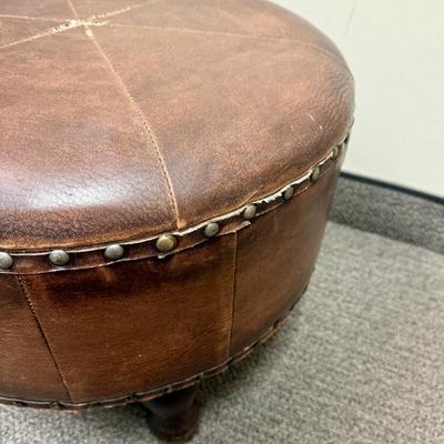 Sale Photo Thumbnail #176: Covered in brown leather, some loose stitching in the top center (see photos).