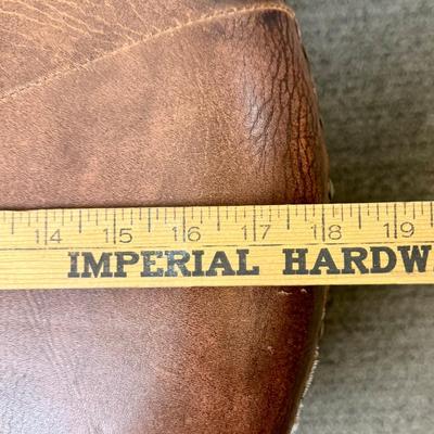 Sale Photo Thumbnail #175: Covered in brown leather, some loose stitching in the top center (see photos).