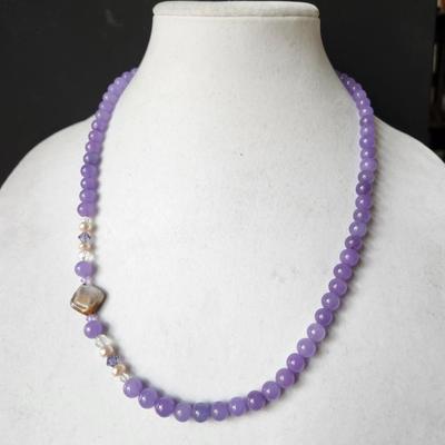 Sale Photo Thumbnail #234: This is so beautiful, solid necklace with tourmaline stone .
Similar prices for this jade is about $200