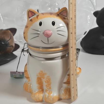 LOT 76L: MEOW/ Cat Serving Plate, Doorstop, Canister, Carved Wooden Figure, Lenox Figurine, Music Box, Spoon Rest, Brass Key Hanger, and...