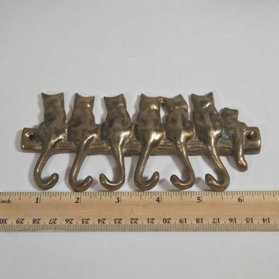 LOT 76L: MEOW/ Cat Serving Plate, Doorstop, Canister, Carved Wooden Figure, Lenox Figurine, Music Box, Spoon Rest, Brass Key Hanger, and...
