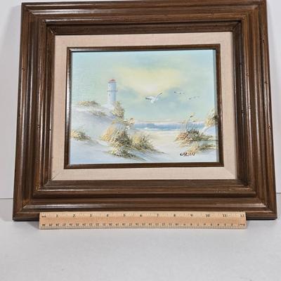 LOT 81L: Signed Seascape Oil Painting by Carson, Coasters, Salt & Pepper Shakers, Cast Iron Fisherman , and Lighthouse Print