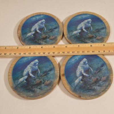 LOT 81L: Signed Seascape Oil Painting by Carson, Coasters, Salt & Pepper Shakers, Cast Iron Fisherman , and Lighthouse Print