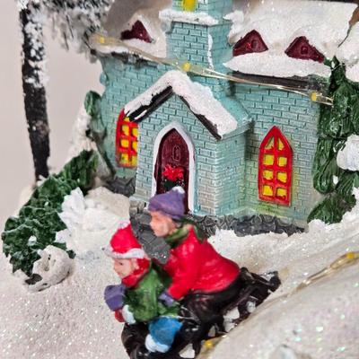 LOT 169X: Alpine Corp. Indoor Animated Winter Wonderland Set with LED lights, Music, Moving Train, and Ice-skaters