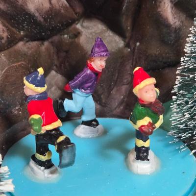 LOT 169X: Alpine Corp. Indoor Animated Winter Wonderland Set with LED lights, Music, Moving Train, and Ice-skaters