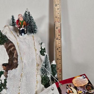 LOT 169X: Alpine Corp. Indoor Animated Winter Wonderland Set with LED lights, Music, Moving Train, and Ice-skaters