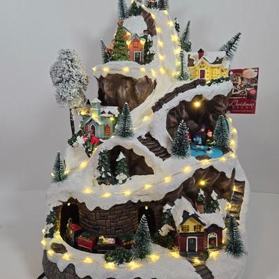 LOT 169X: Alpine Corp. Indoor Animated Winter Wonderland Set with LED lights, Music, Moving Train, and Ice-skaters