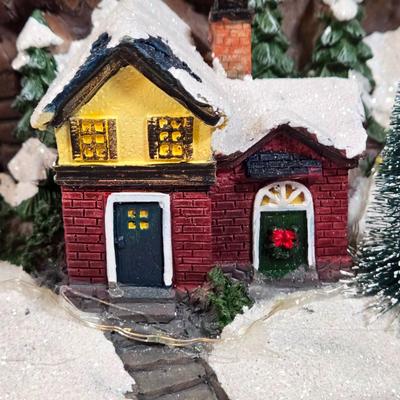 LOT 169X: Alpine Corp. Indoor Animated Winter Wonderland Set with LED lights, Music, Moving Train, and Ice-skaters