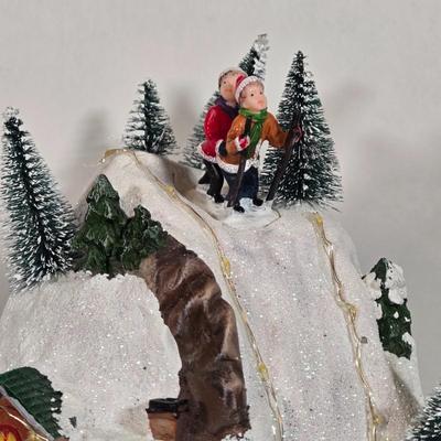 LOT 169X: Alpine Corp. Indoor Animated Winter Wonderland Set with LED lights, Music, Moving Train, and Ice-skaters