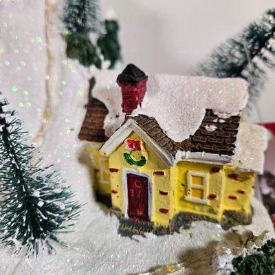 LOT 169X: Alpine Corp. Indoor Animated Winter Wonderland Set with LED lights, Music, Moving Train, and Ice-skaters