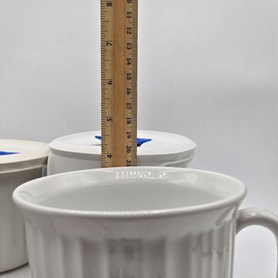 LOT 197L: CorningWare French White 20 oz. Meal Mugs with Vented Lids, 16 oz. Round Ramekins with Vented Lids, and Cornflower Blue Pattern...